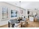 Inviting dining area with hardwood floors, shuttered windows, and seamless transition to living spaces at 204 Dawson Dr, Woodstock, GA 30188