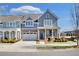 Charming two-story townhome with a brick facade, covered porch, and a well-manicured front yard at 204 Dawson Dr, Woodstock, GA 30188