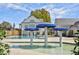 Community pool with water features and lounge chairs at 204 Dawson Dr, Woodstock, GA 30188