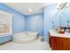 Bathroom with corner jacuzzi tub and updated vanity at 24 Planters Sw Dr, Lilburn, GA 30047