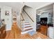 Bright entryway with hardwood floors and staircase at 24 Planters Sw Dr, Lilburn, GA 30047