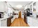 Modern kitchen with white cabinets and granite countertops at 24 Planters Sw Dr, Lilburn, GA 30047