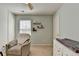 Cozy bedroom with a chair, window, dresser, and neutral color palette at 221 Kenninghall Se Ln, Smyrna, GA 30082