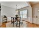 Cozy dining area with stylish light fixture and wainscoting detail at 221 Kenninghall Se Ln, Smyrna, GA 30082