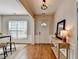 Inviting foyer with hardwood floors, wainscoting and an elegant console table at 221 Kenninghall Se Ln, Smyrna, GA 30082