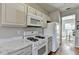 Spacious kitchen with marble countertops and white appliances at 221 Kenninghall Se Ln, Smyrna, GA 30082