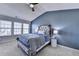 Spacious main bedroom features vaulted ceiling, large window and custom decor at 221 Kenninghall Se Ln, Smyrna, GA 30082