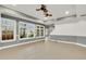 Bright basement area with multiple windows and gray walls at 2265 Wildwood Lake Dr, Suwanee, GA 30024