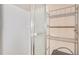 Small basement bathroom with shower and shelving at 2265 Wildwood Lake Dr, Suwanee, GA 30024