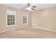 Well-lit bedroom with ceiling fan and neutral wall color at 2265 Wildwood Lake Dr, Suwanee, GA 30024