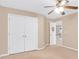 Bedroom with double doors leading to a large closet and loft at 2265 Wildwood Lake Dr, Suwanee, GA 30024