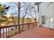 Lake view deck with wooden railing and seating at 2265 Wildwood Lake Dr, Suwanee, GA 30024