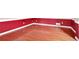 Hardwood floor dining room with red walls and wainscoting at 2265 Wildwood Lake Dr, Suwanee, GA 30024