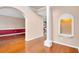 Hardwood floors and an arched hallway leading to other rooms at 2265 Wildwood Lake Dr, Suwanee, GA 30024