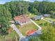 Aerial view of a ranch home with a spacious yard and surrounding trees at 2815 Spain Dr, East Point, GA 30344