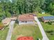 Aerial view of a ranch home with a newly paved driveway and landscaped yard at 2815 Spain Dr, East Point, GA 30344