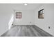 Spacious bedroom with gray vinyl flooring and large windows at 2815 Spain Dr, East Point, GA 30344