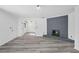 Living room featuring a modern fireplace and gray vinyl flooring at 2815 Spain Dr, East Point, GA 30344