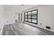 Bright and airy living room with gray flooring and large black framed windows at 2815 Spain Dr, East Point, GA 30344