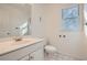 Clean bathroom includes a toilet, sink, and shower at 3422 Sweetbriar Ln, Powder Springs, GA 30127