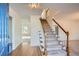 Bright entryway with hardwood floors and staircase at 3422 Sweetbriar Ln, Powder Springs, GA 30127