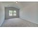 Spacious bedroom with carpet, vaulted ceiling and two windows at 512 Dolce Rd, Locust Grove, GA 30248