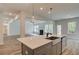 Open concept kitchen with island and views to living areas at 512 Dolce Rd, Locust Grove, GA 30248