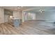 Spacious living room with hardwood floors and access to kitchen at 512 Dolce Rd, Locust Grove, GA 30248