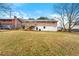 Large backyard with home and wooden deck at 64 Valley Hill Sw Rd, Riverdale, GA 30274