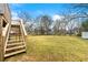 Spacious backyard with wooden deck and steps at 64 Valley Hill Sw Rd, Riverdale, GA 30274