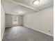 Unfinished basement room with window and grey flooring at 64 Valley Hill Sw Rd, Riverdale, GA 30274