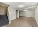 Unfinished basement with laminate flooring and ample space at 64 Valley Hill Sw Rd, Riverdale, GA 30274