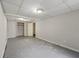 Unfinished basement room with closet and grey flooring at 64 Valley Hill Sw Rd, Riverdale, GA 30274