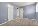 Simple bedroom with neutral walls and carpet flooring at 64 Valley Hill Sw Rd, Riverdale, GA 30274