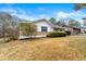 Side view of ranch house, showcasing lawn at 64 Valley Hill Sw Rd, Riverdale, GA 30274