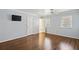 Spacious bedroom with hardwood floors and neutral walls at 1859 Olde Village Run, Dunwoody, GA 30338