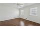 Bedroom with hardwood floors and ceiling fan at 1859 Olde Village Run, Dunwoody, GA 30338