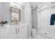 Modern bathroom with white vanity, gold fixtures, and a large walk-in shower at 250 Park W Ave # 701, Atlanta, GA 30313