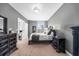 Spacious bedroom with dark wood furniture and neutral color scheme at 250 Park W Ave # 701, Atlanta, GA 30313