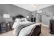 Spacious bedroom with dark wood furniture and neutral color scheme at 250 Park W Ave # 701, Atlanta, GA 30313
