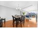 Dining area with hardwood floors, a large table, and access to living area at 250 Park W Ave # 701, Atlanta, GA 30313