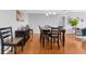 Hardwood floor dining room with a dark wood table and chairs at 250 Park W Ave # 701, Atlanta, GA 30313