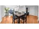 Open dining area with hardwood floors and a view of the living room at 250 Park W Ave # 701, Atlanta, GA 30313