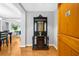 Wood floors and a dark wood hall tree in a condo entryway at 250 Park W Ave # 701, Atlanta, GA 30313