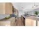 Modern kitchen with stainless steel appliances and an island with seating at 250 Park W Ave # 701, Atlanta, GA 30313