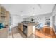 Modern kitchen with stainless steel appliances and an island with seating at 250 Park W Ave # 701, Atlanta, GA 30313