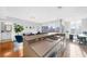 Modern kitchen with stainless steel appliances and an island with seating at 250 Park W Ave # 701, Atlanta, GA 30313