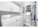 Bright laundry room with side-by-side Maytag washer and dryer at 250 Park W Ave # 701, Atlanta, GA 30313