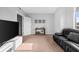 Bright living room with a comfortable couch and large TV at 250 Park W Ave # 701, Atlanta, GA 30313