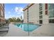 Relaxing rooftop pool with surrounding lounge chairs and city views at 250 Park W Ave # 701, Atlanta, GA 30313